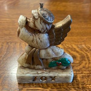 Vintage angel candle with joy in two languages Joie. Just under 2” wide.